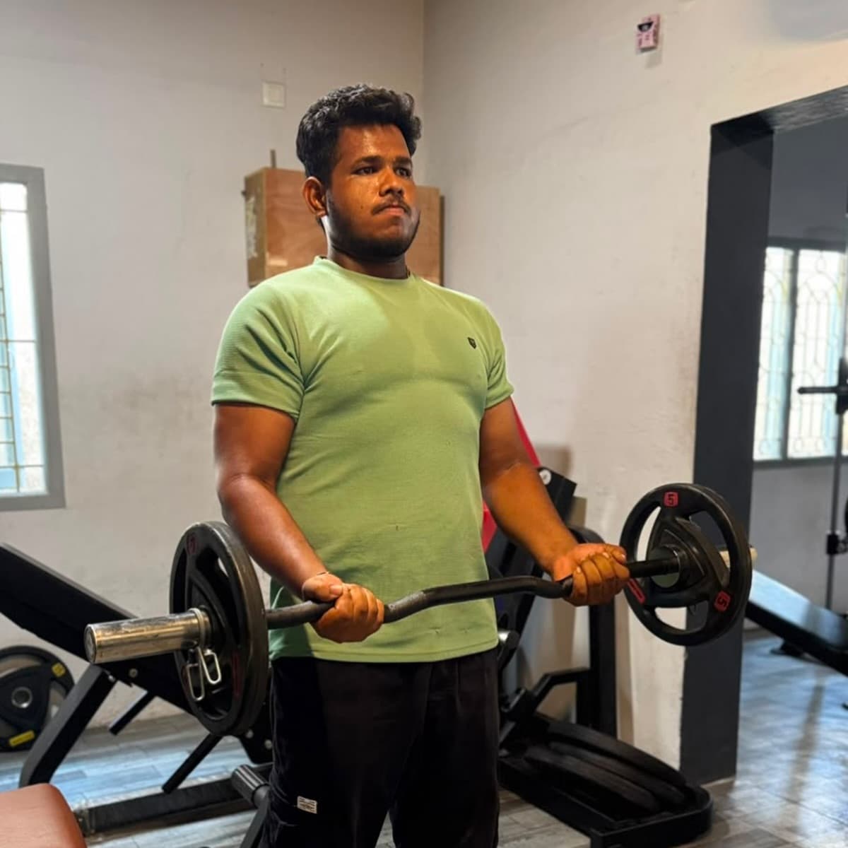 Client training with barbell curls