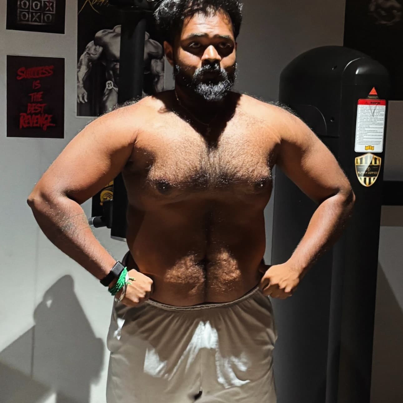 Client posing in the gym